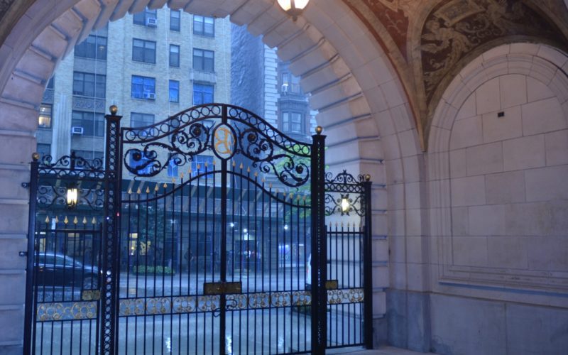 Belnord front gate on rainy night